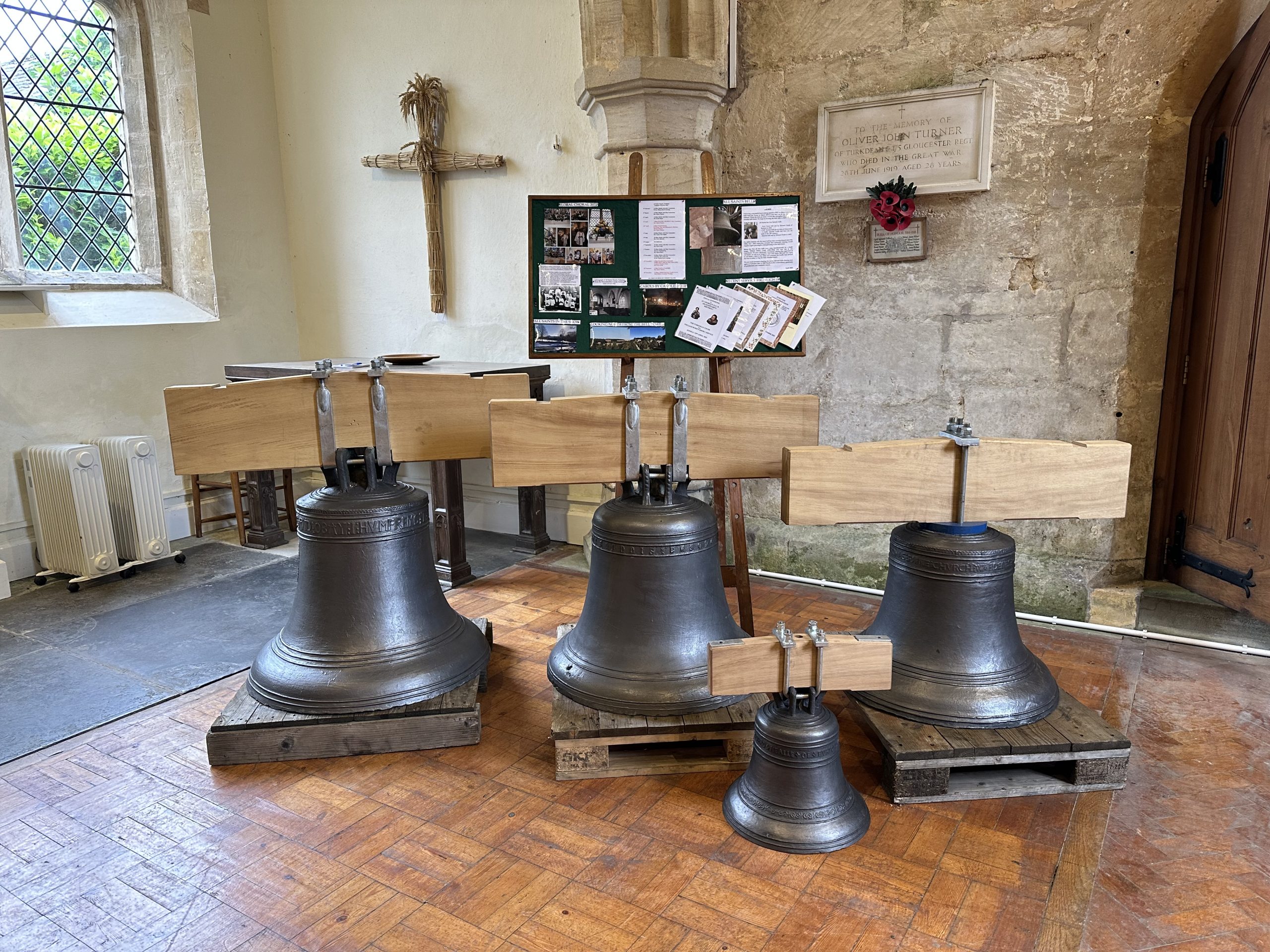 The restored bells of All Saints Church, Turkdean ready to be rehung from the newly strengthened bell frame